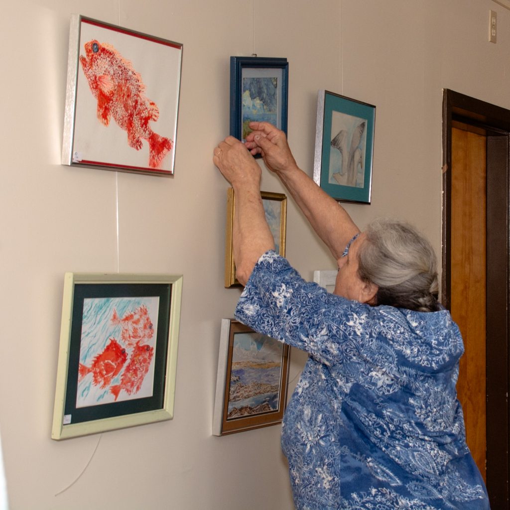 woman setting up her display