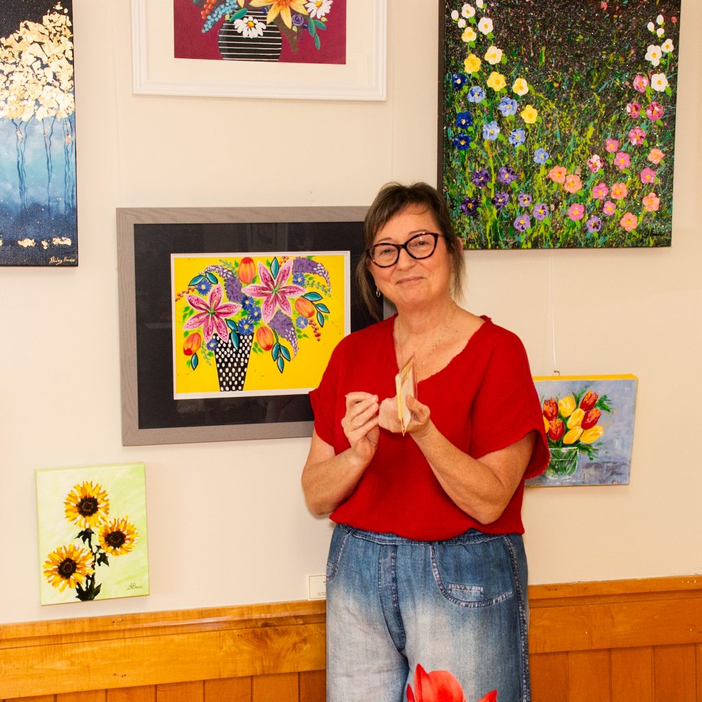 woman setting up her art display